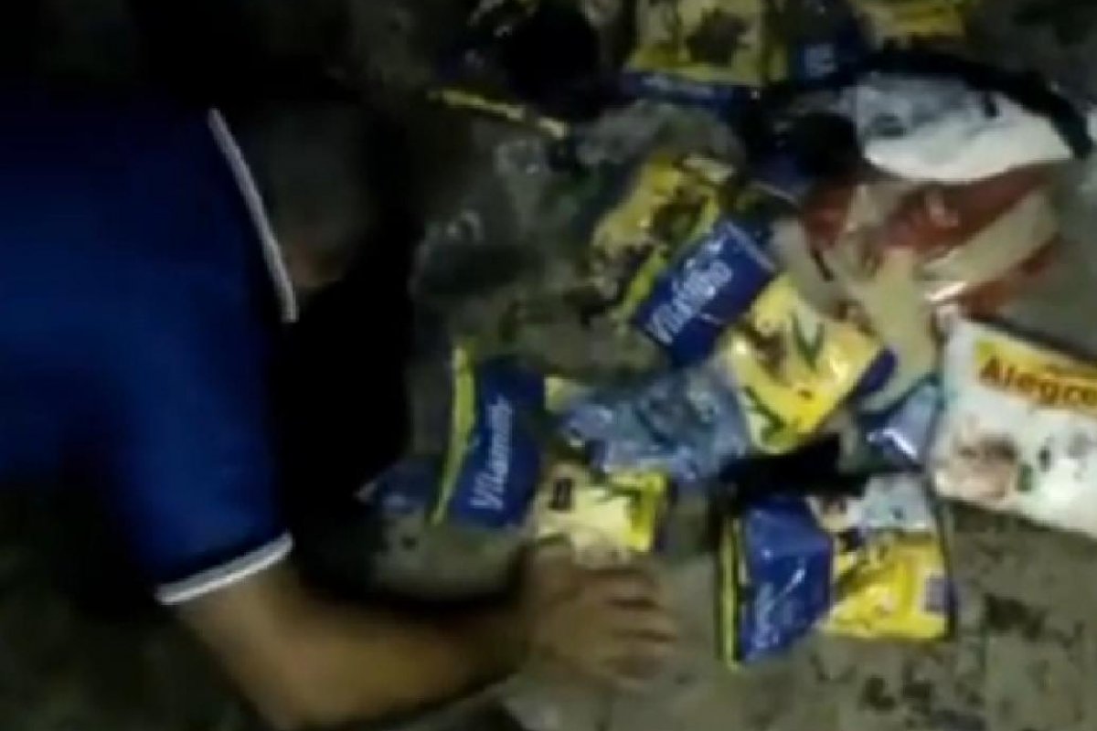Veja vídeo: Homem desenterra mais de 30 kg de alimentos em colégio estadual de Natal, no RN
