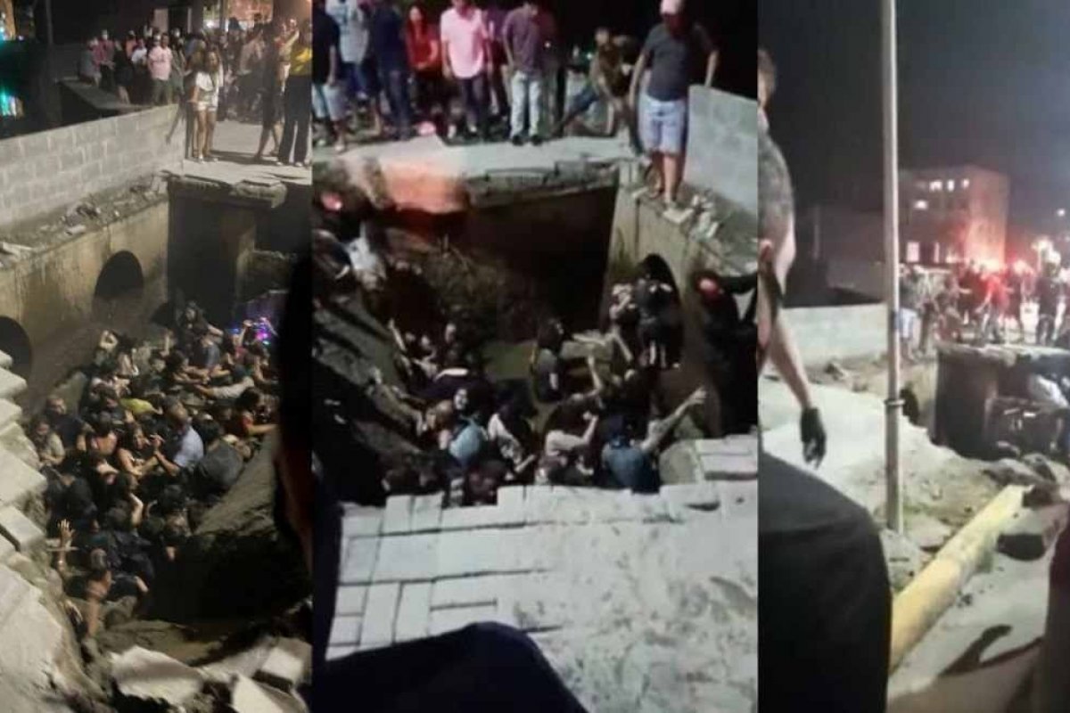 Video: Calçada cede e pessoas caem em rio durante evento de Natal em Joinville